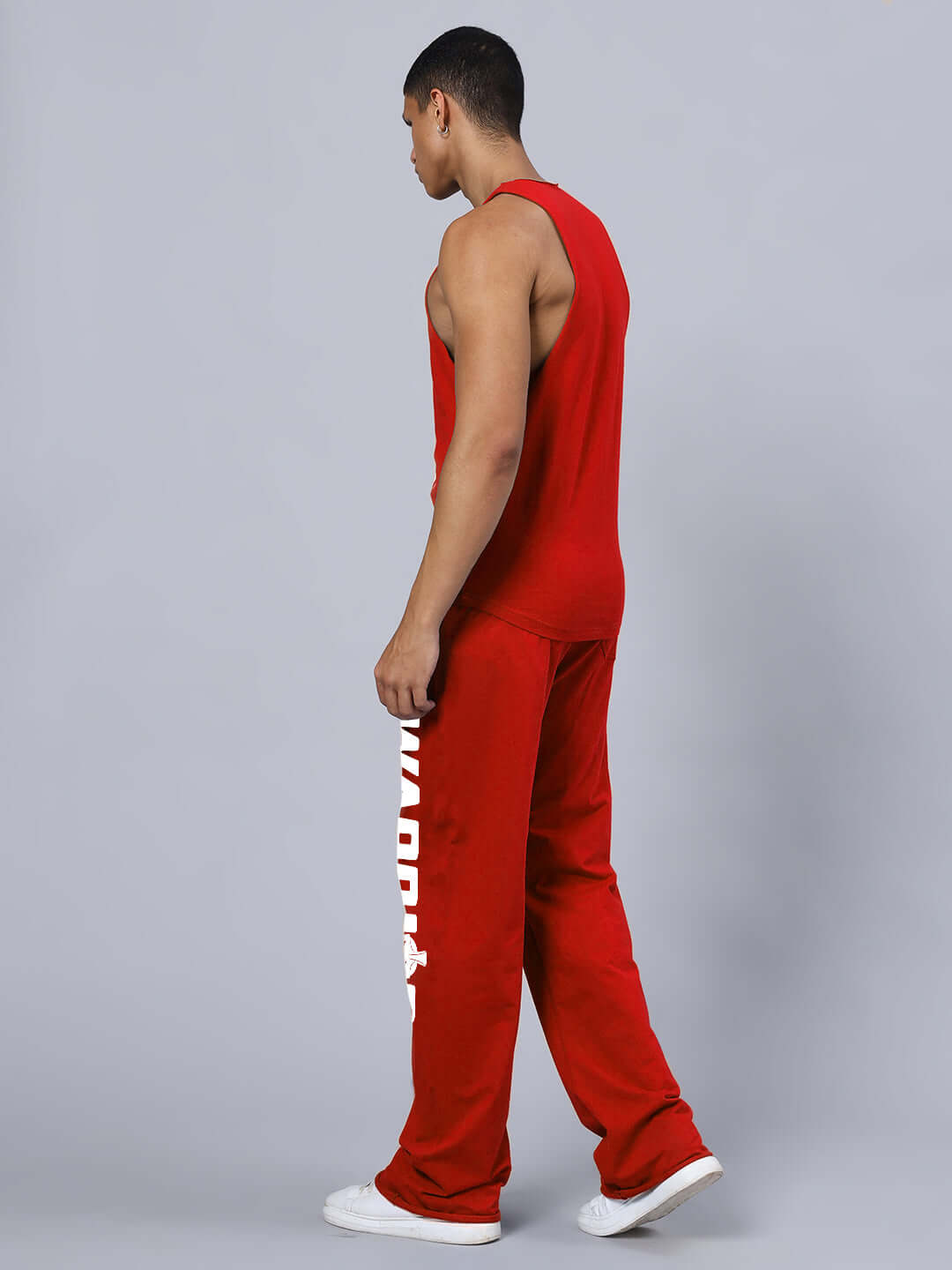Man wearing WARRIOR PRINTED GYM RELAXED FIT CO-ORD SET RED, showcasing bold style and athletic functionality
