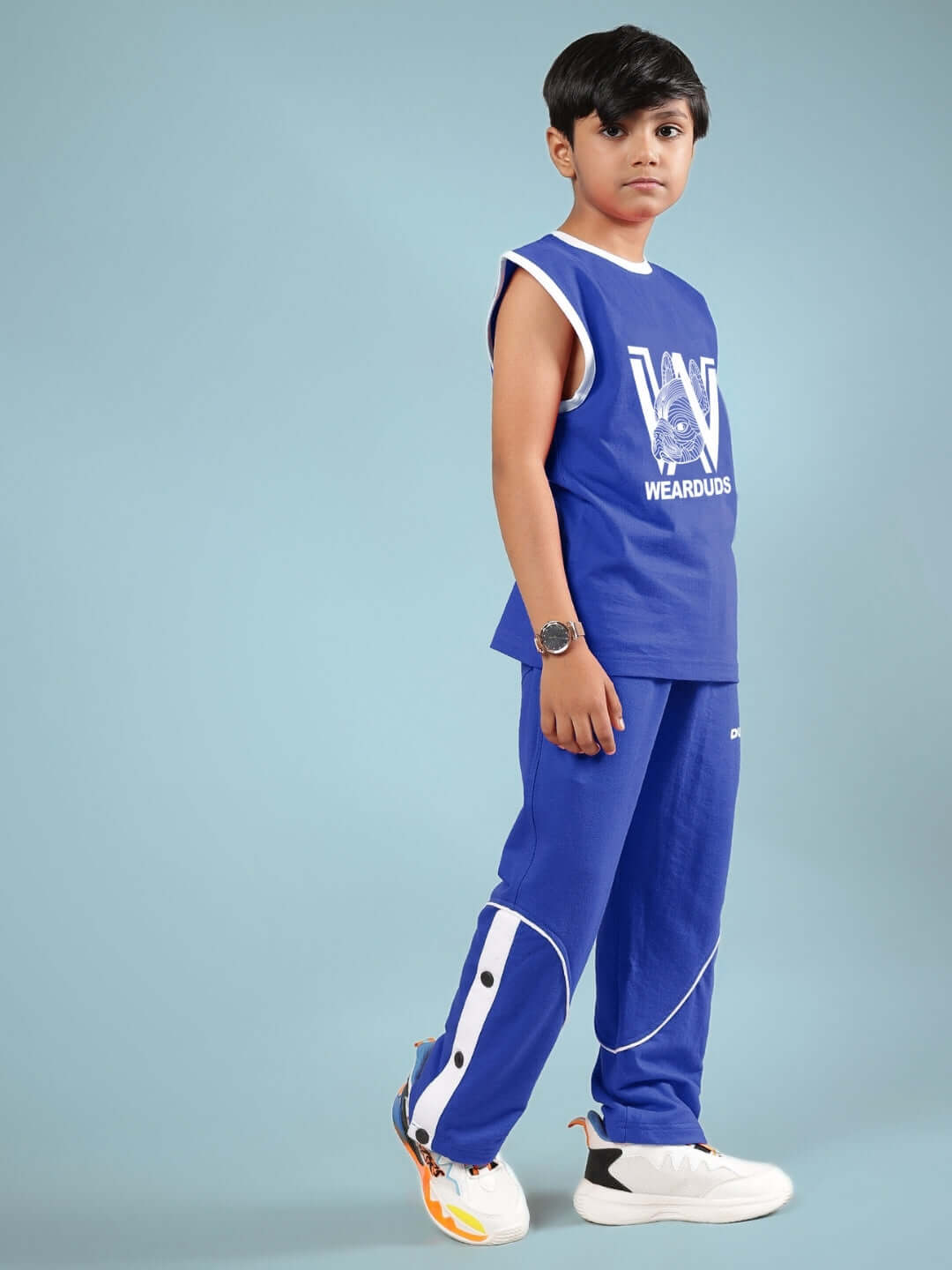 Boy wearing WASHINGTON HUSKIES CO-ORD FOR BOYS & GIRLS BLUE, showcasing trendy casual wear suitable for kids.