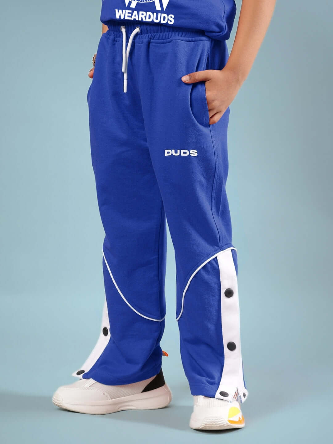 Child wearing the WASHINGTON HUSKIES CO-ORD FOR BOYS & GIRLS BLUE with DUDS branding.