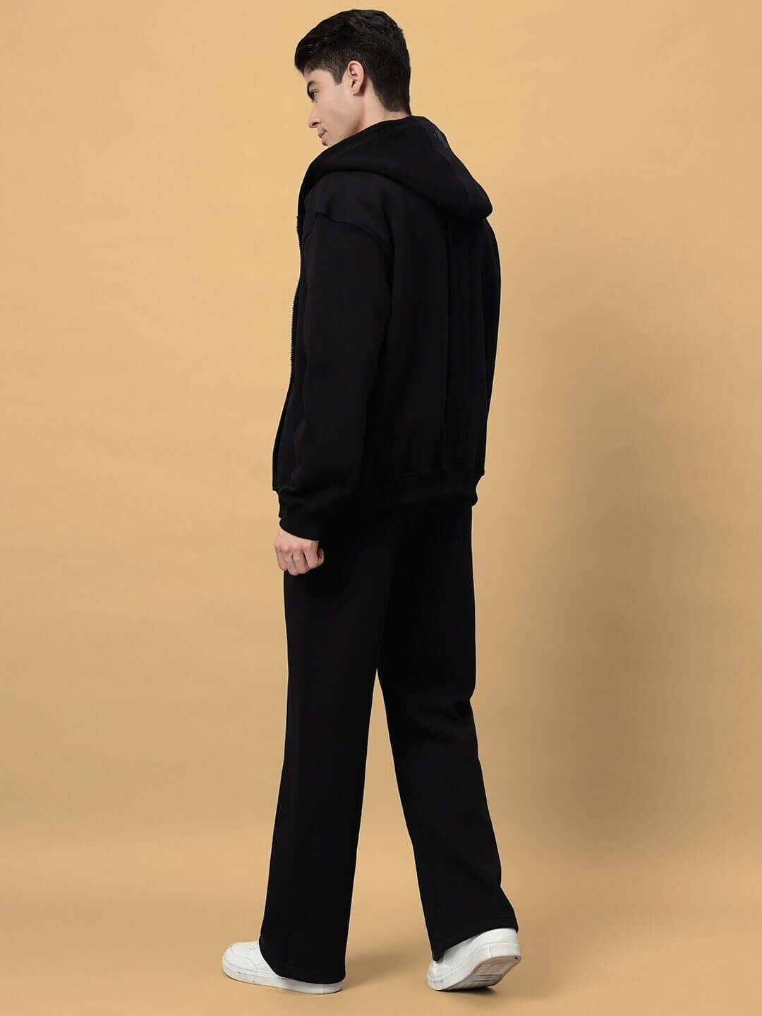 Model wearing WD ADMIRE Co-Ord in black, side view showcasing hoodie and pants, made-to-order with custom fit options.