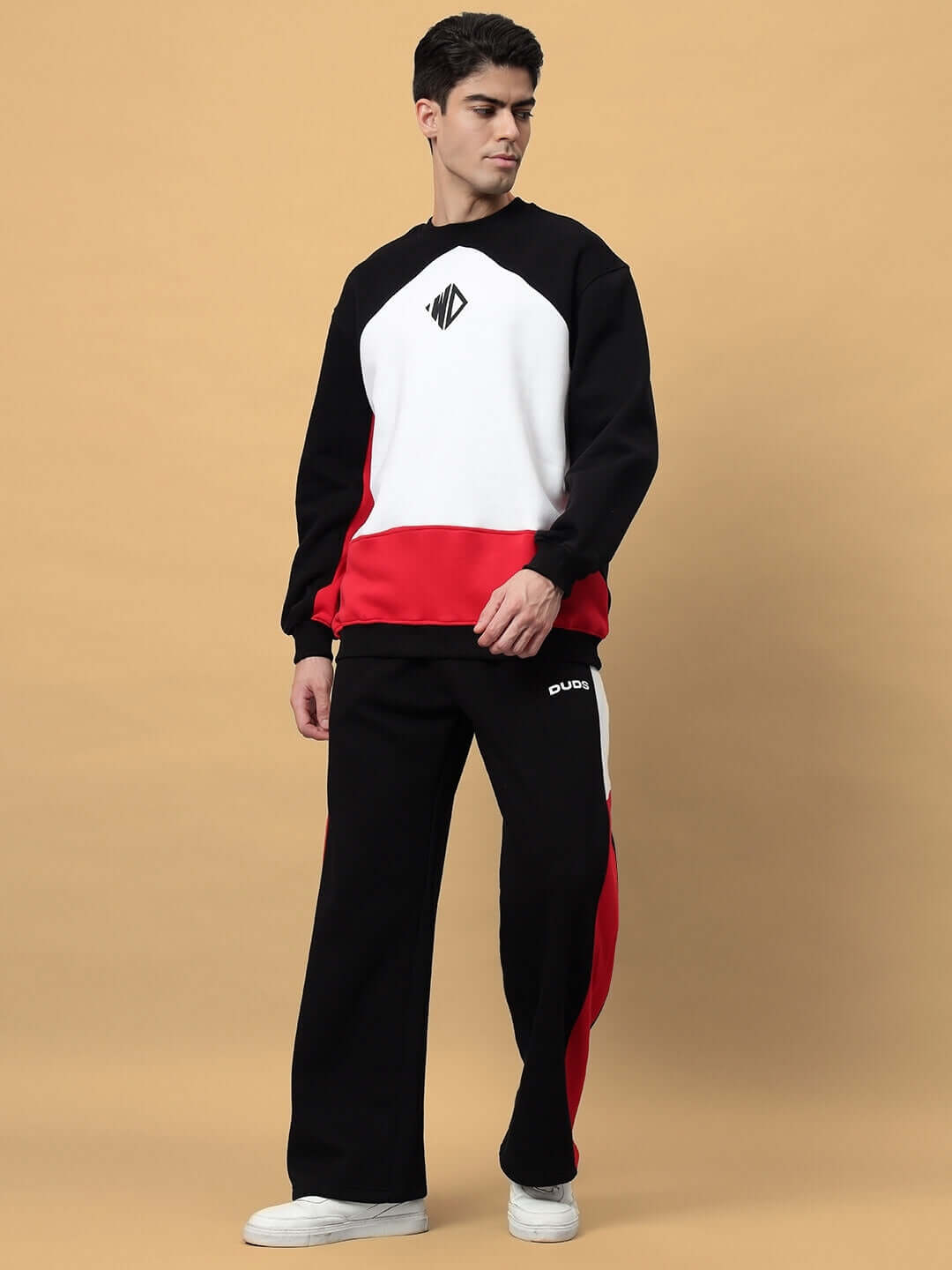 Model wearing WD FERVID Colorblock Co-ord in black with red and white accents, showcasing custom fit apparel by DUDS.