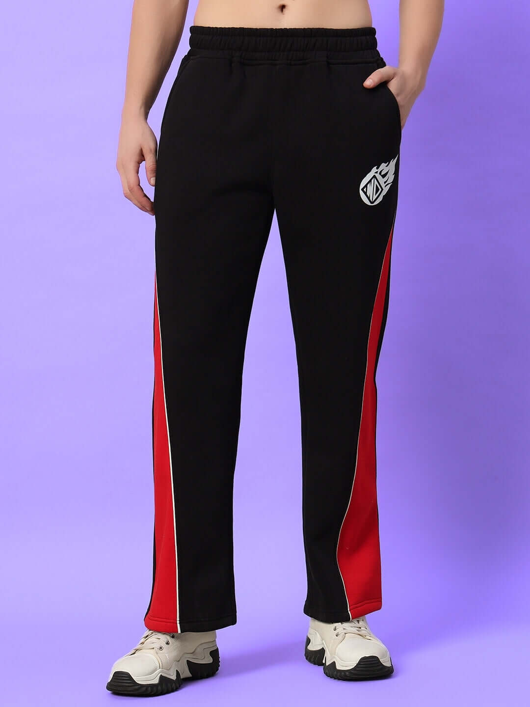 Person wearing black and red WD Fireball Colorblock Cargo Pants, showcasing stylish casual wear on a purple background.