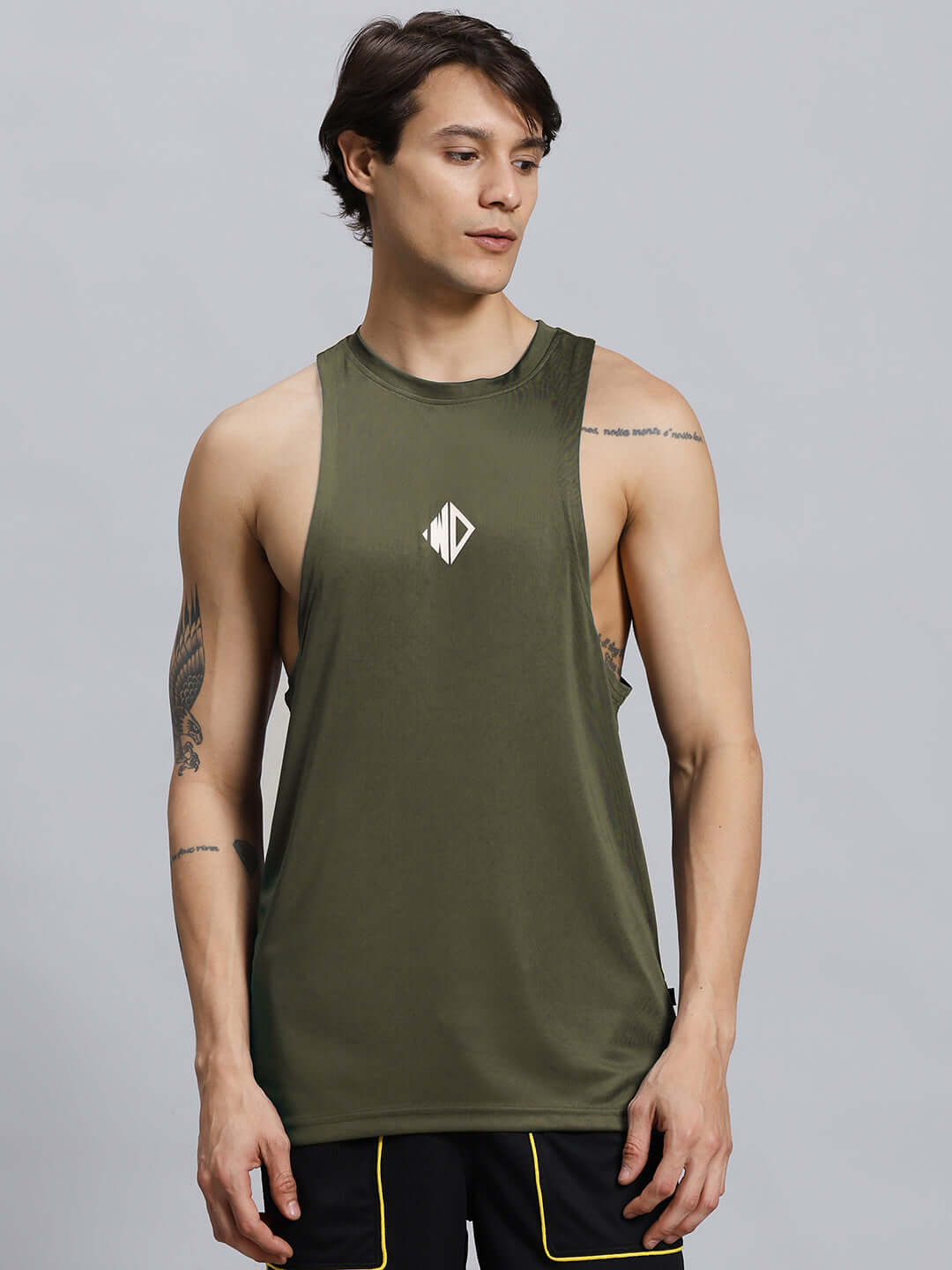Man wearing WD STRINGER GYM SLEEVELESS T-SHIRT GREEN for workout