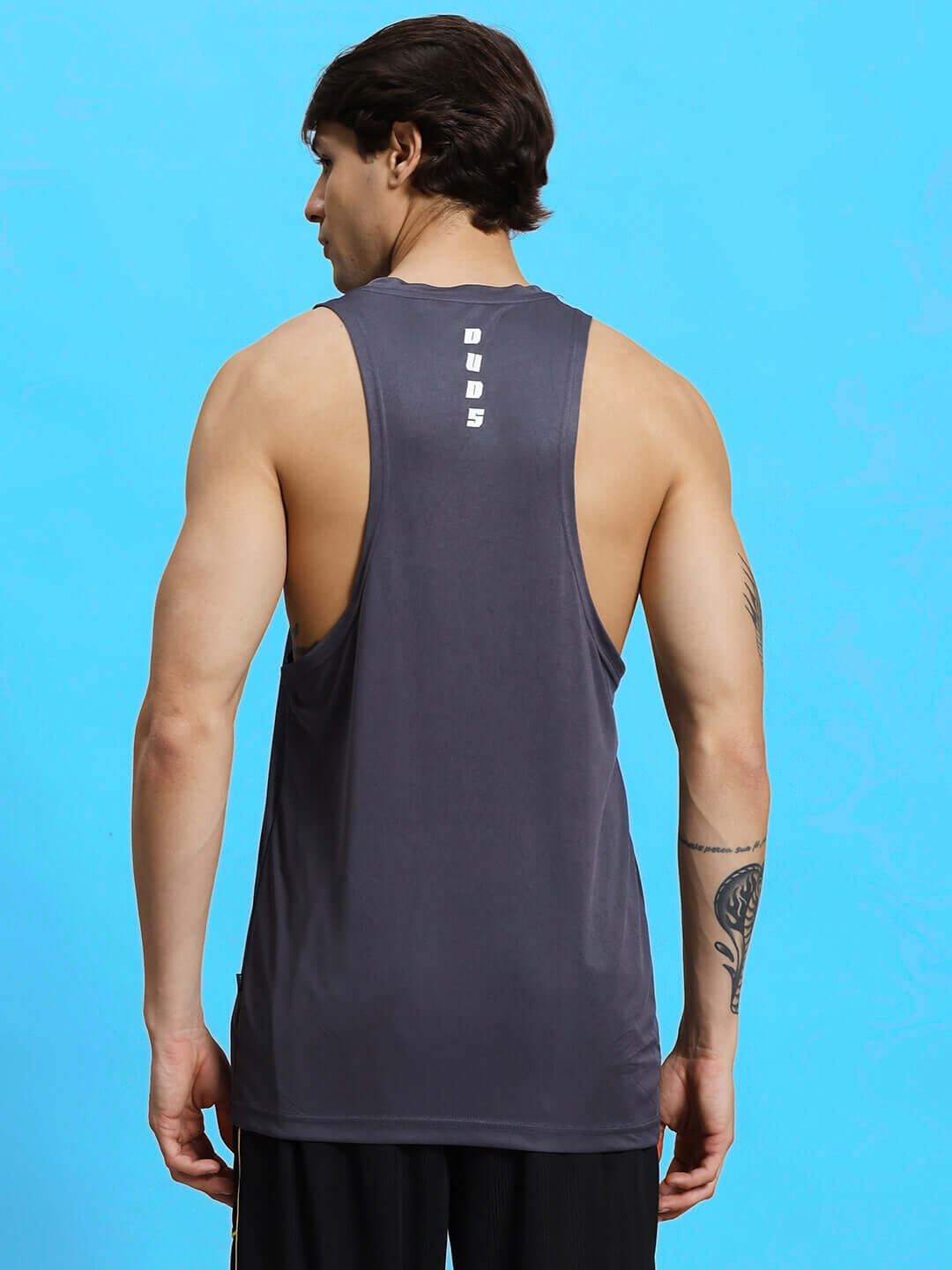 WD STRINGER SLEEVELESS GYM T-SHIRT GREY shown from the back on a model, highlighting the fit and material.