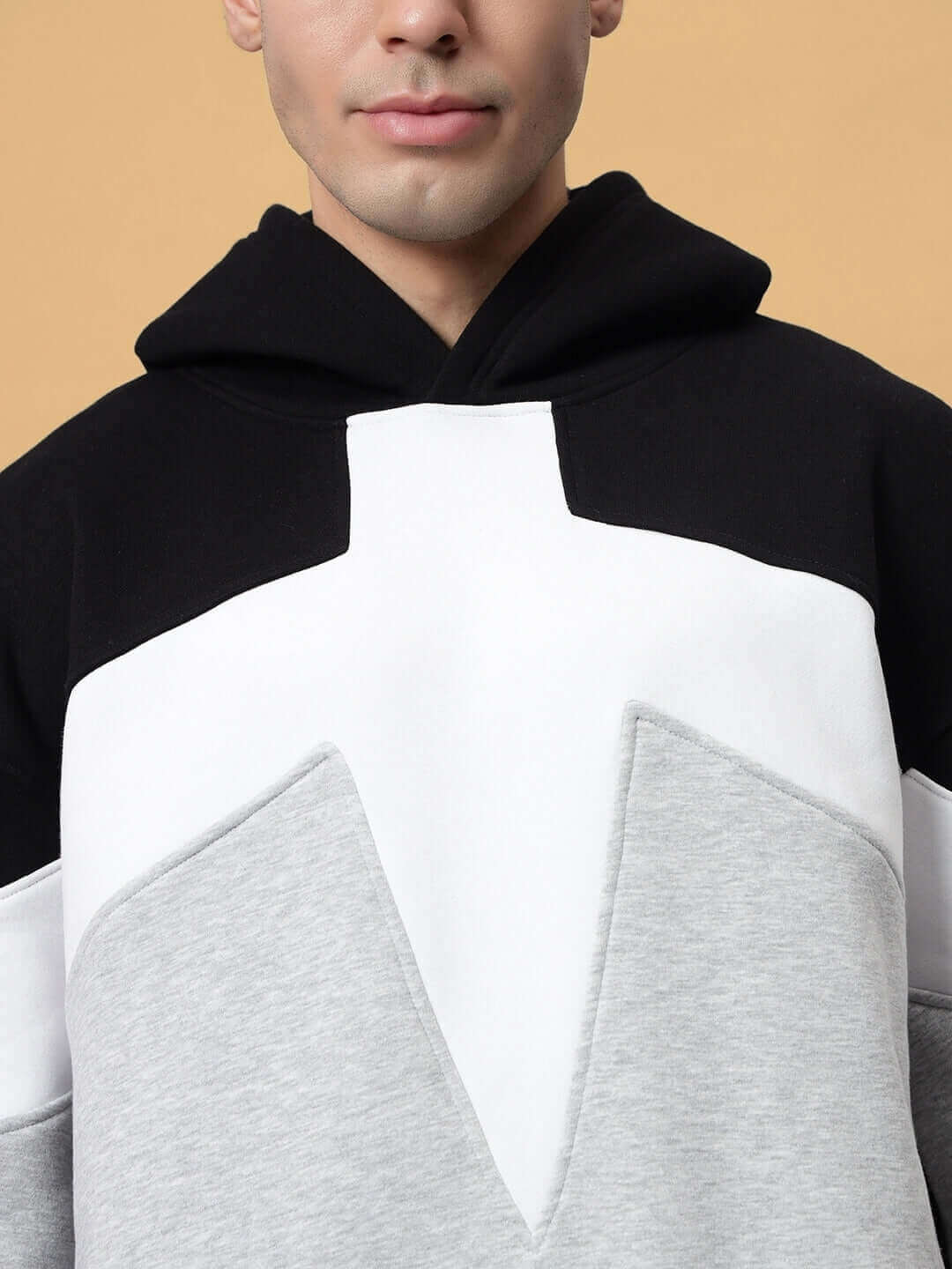 Close-up of black-grey colorblock hoodie from WD Sword Co-ord, available with custom fit options.