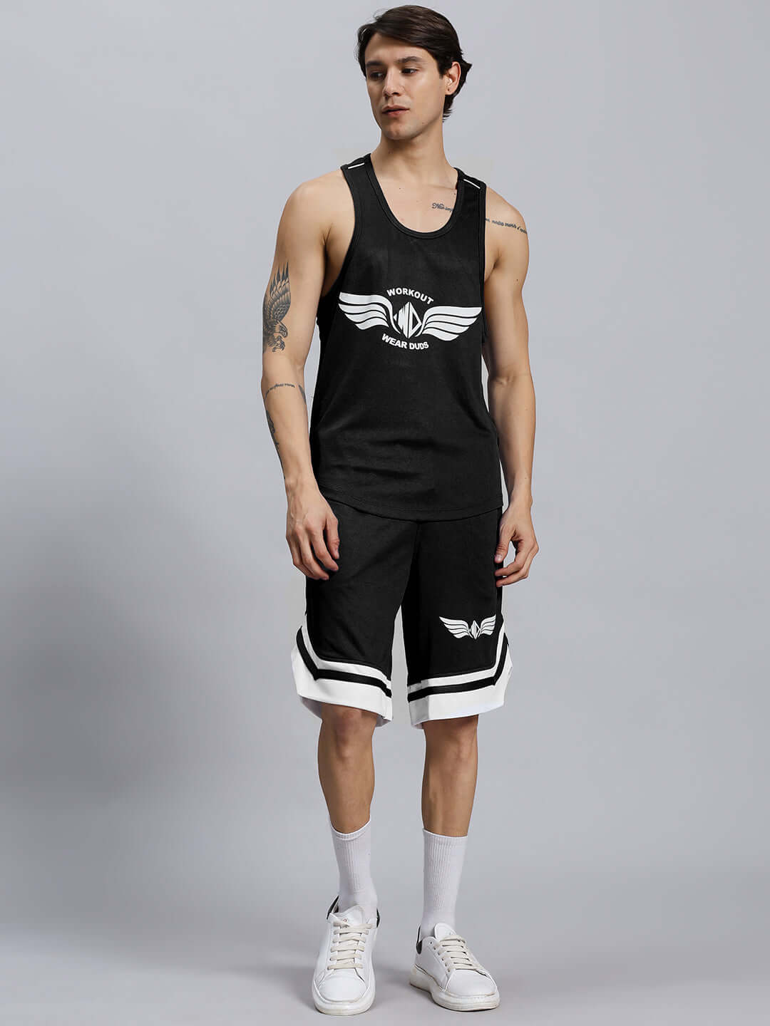 Man wearing WD WINGS GYM CO-ORD SET MEN BLACK, featuring high-performance, breathable fabric for comfort and flexibility in workouts.