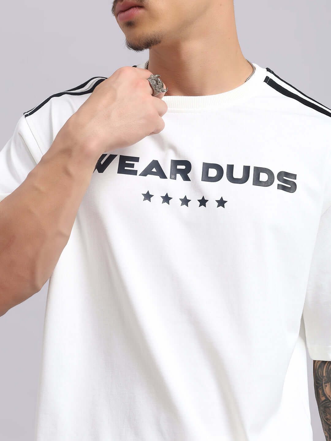 Men's white t-shirt with 'Wear Duds' print and black stripes on shoulders.