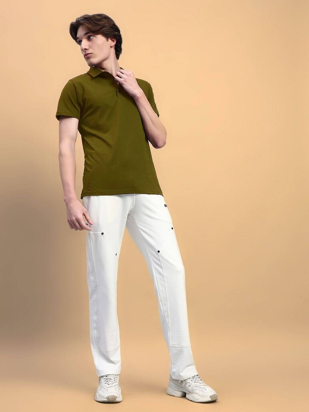 Model wearing olive green WIDEL regular fit T-shirt with white pants, showcasing premium 97% cotton French Terry Lycra blend.