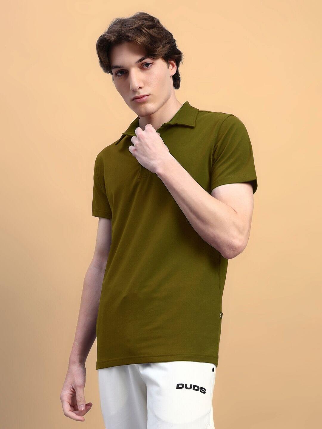 Model wearing olive green Widell regular fit t-shirt, premium cotton terry lycra, stylish and comfortable for everyday wear.