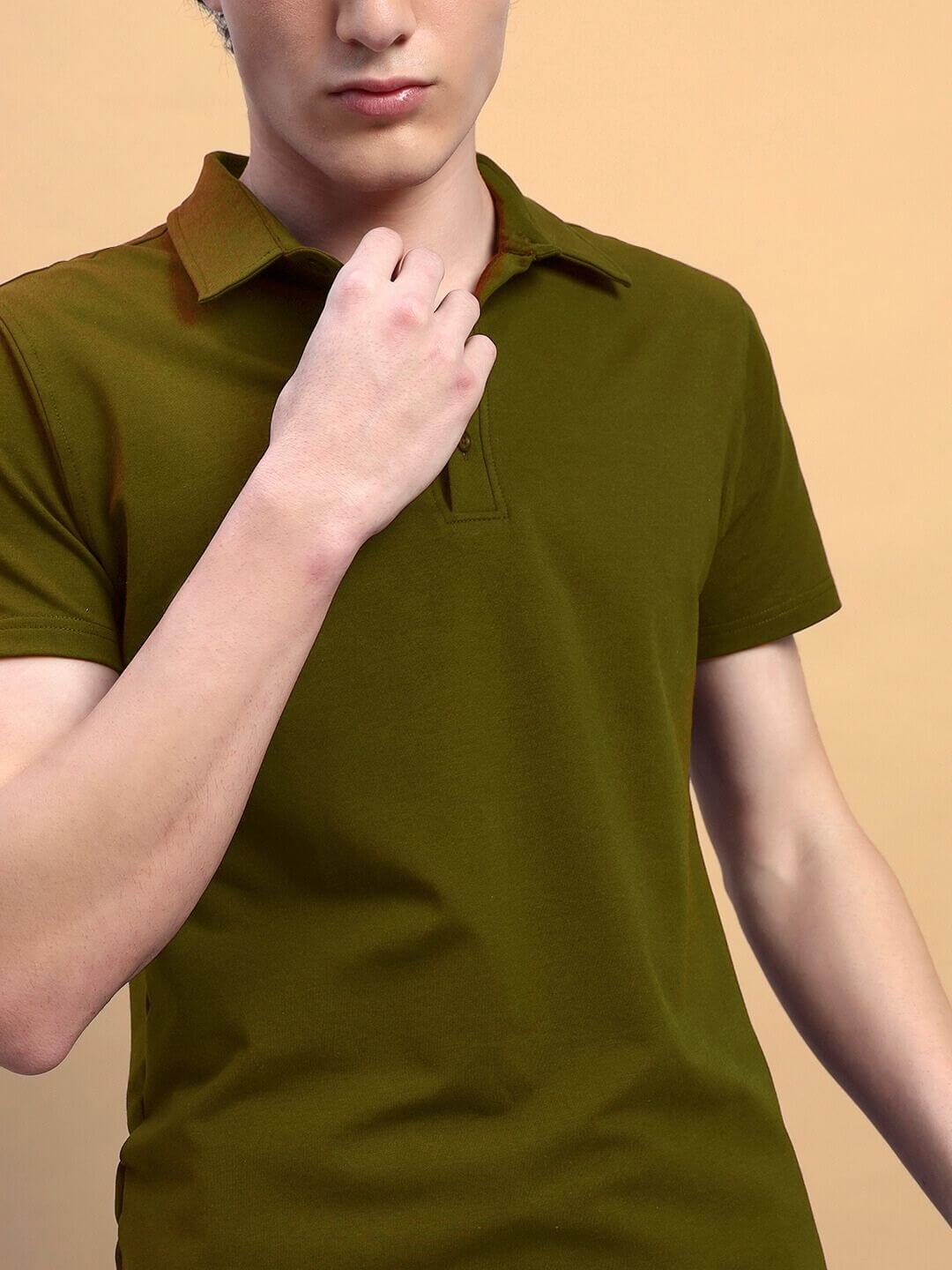 Man wearing WIDEL regular fit olive green t-shirt made of premium cotton french terry lycra, showcasing casual style.