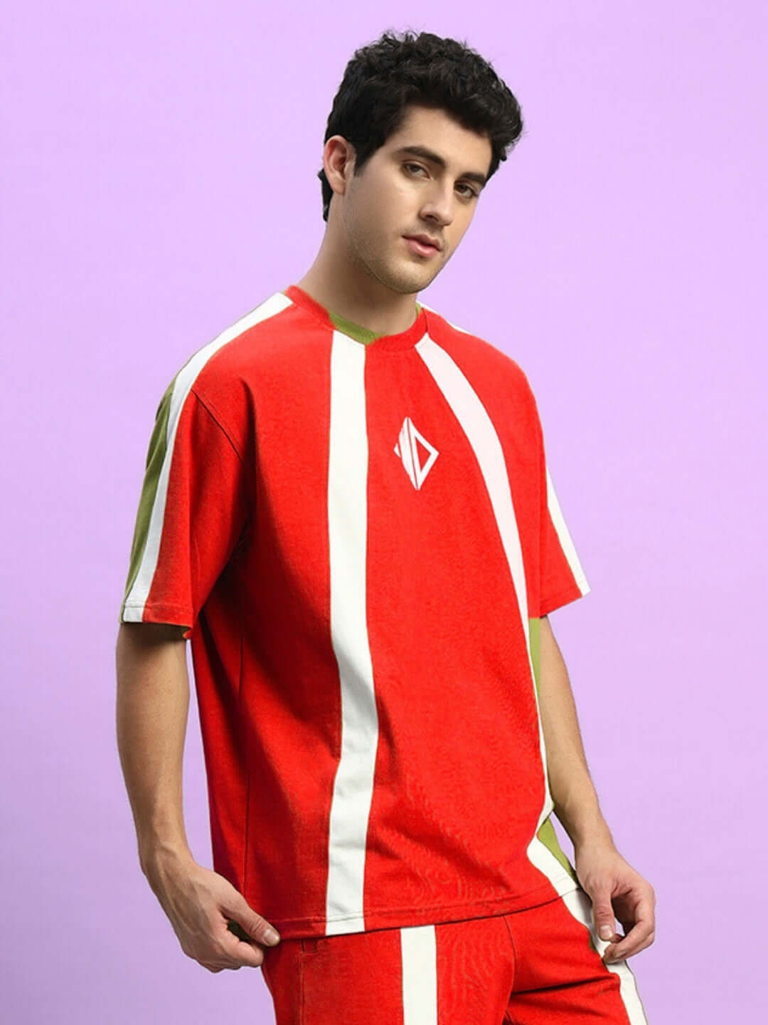 Man wearing Wideline Over-Sized T-Shirt Red with bold design, crafted from premium cotton-blend fabric, showcasing streetwear style.