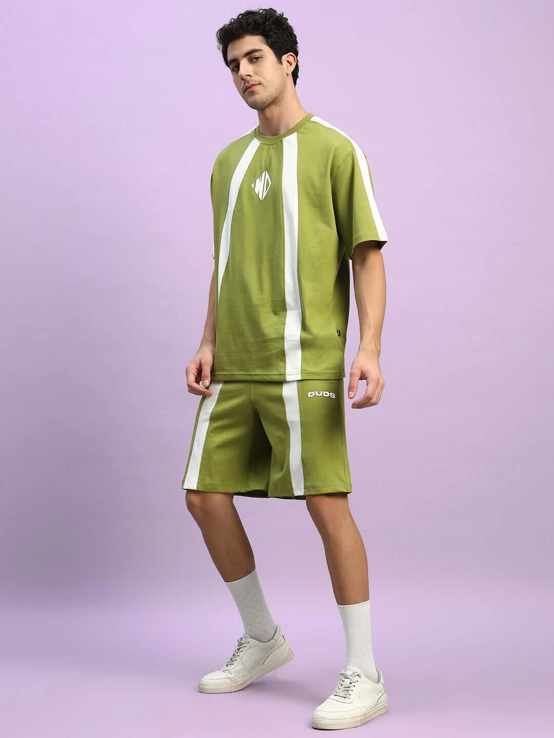 Model wearing WIDELINE SUMMER CO-ORD SET OLIVE GREEN made from premium cotton and elastane blend.