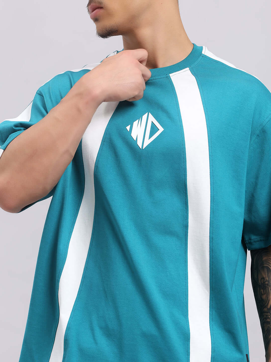 Model wearing WIDELINE SUMMER CO-ORD SET TEAL with white stripes and logo, 97% Cotton French Terry Lycra, stylish summer fashion.