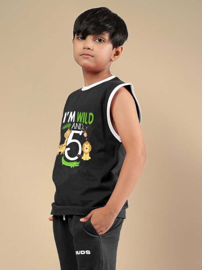 Young boy wearing Wild Planet T-Shirt for Boys & Girls Black with wildlife design, perfect for stylish and comfortable wear.