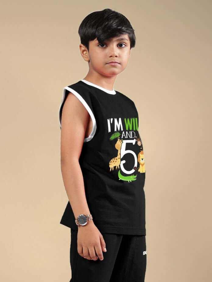 Boy wearing WILD PLANET T-SHIRT FOR BOYS & GIRLS BLACK with sleeveless design and colorful print