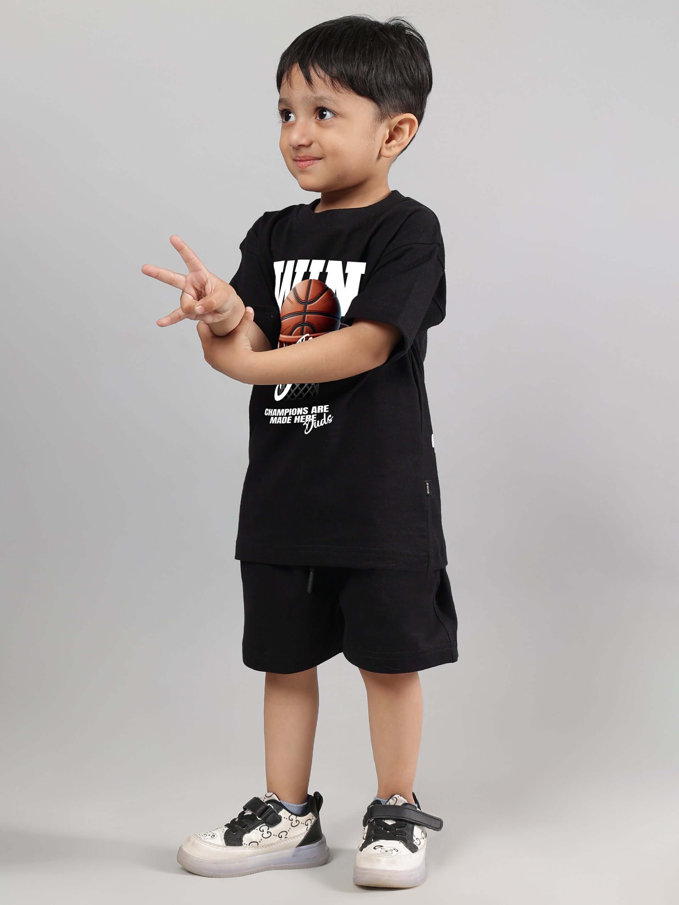 Child wearing WIN DAY CO-ORD FOR BOYS GIRLS BLACK featuring black t-shirt and shorts, stylish unisex outfit for modern streetwear.