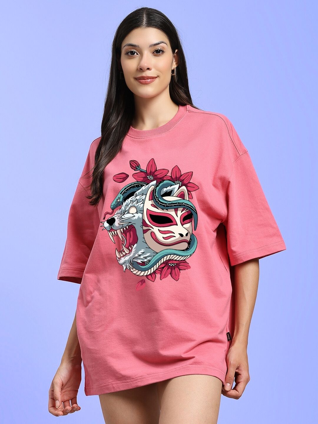Model wearing WOMEN KITSUNE WOLF PRINTED OVERSIZED T-SHIRT PINK with a unique wolf graphic.