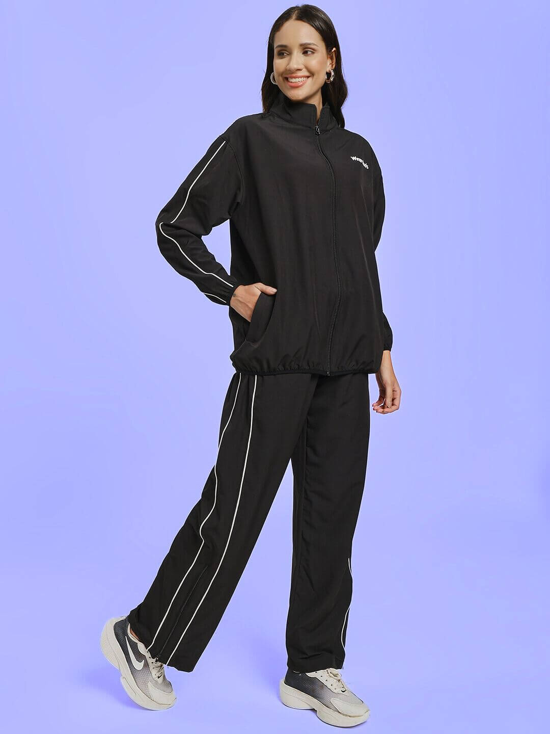 Model wearing WOMEN RELIGHT RELAXED FIT CO-ORD SET BLACK with sleek black design and relaxed fit for effortless style.