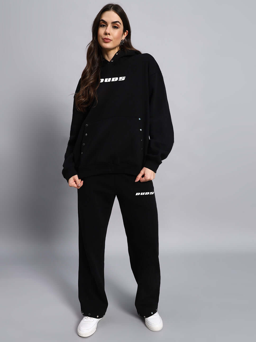 WOMEN RIGID FLEECE HOODIE BLACK worn by model, showing design and fit