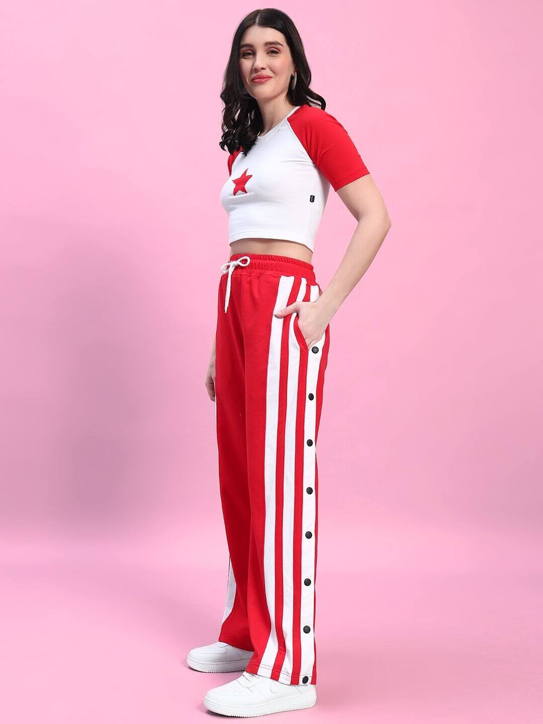 Woman wearing a stylish red and white co-ord set with star detail, featuring premium cotton fabric, designed for comfort and elegance.