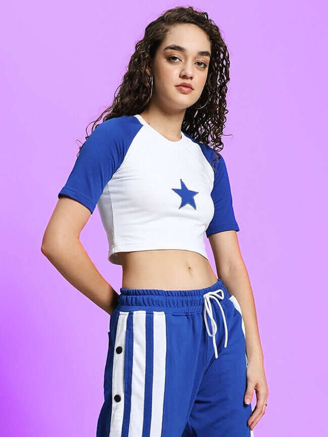 Model wearing Women's Achorm Crop-Top in white and blue with star print, made from premium bio-washed cotton fabric, by Color By Colours.