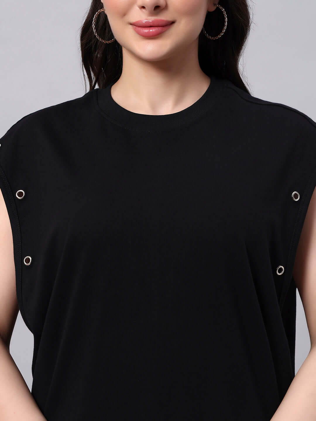 Model wearing WOMENS ALVEN OVERSIZED T-SHIRT BLACK showcasing contemporary oversized fashion with silver hoop earrings.