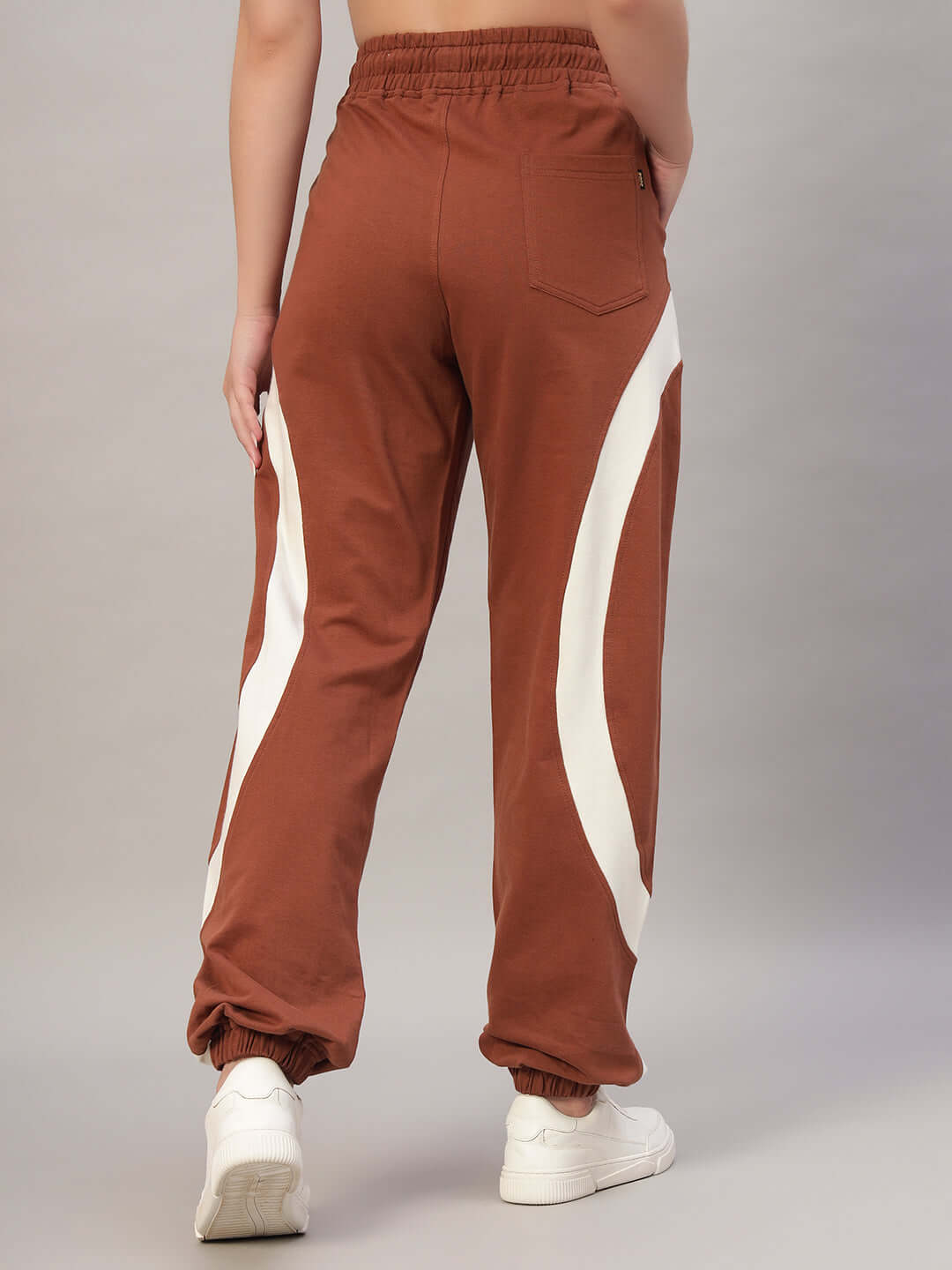 Women's American football joggers in brown with white stripes on the sides, showcasing a stylish design for custom fit options.