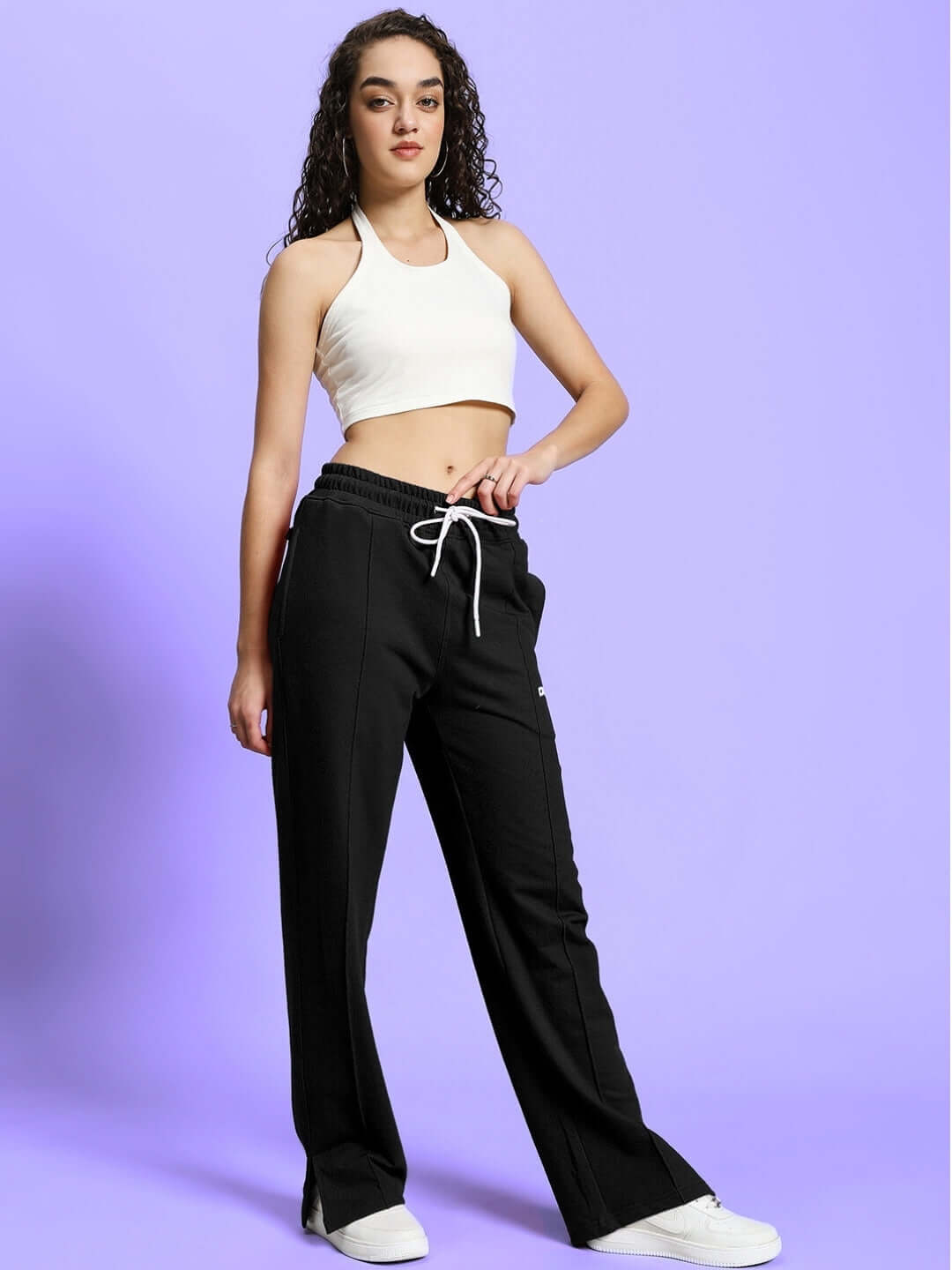 Model wearing the Women's Anissa Co-ord Set in black and off-white, featuring relaxed fit joggers with an elastic waistband.