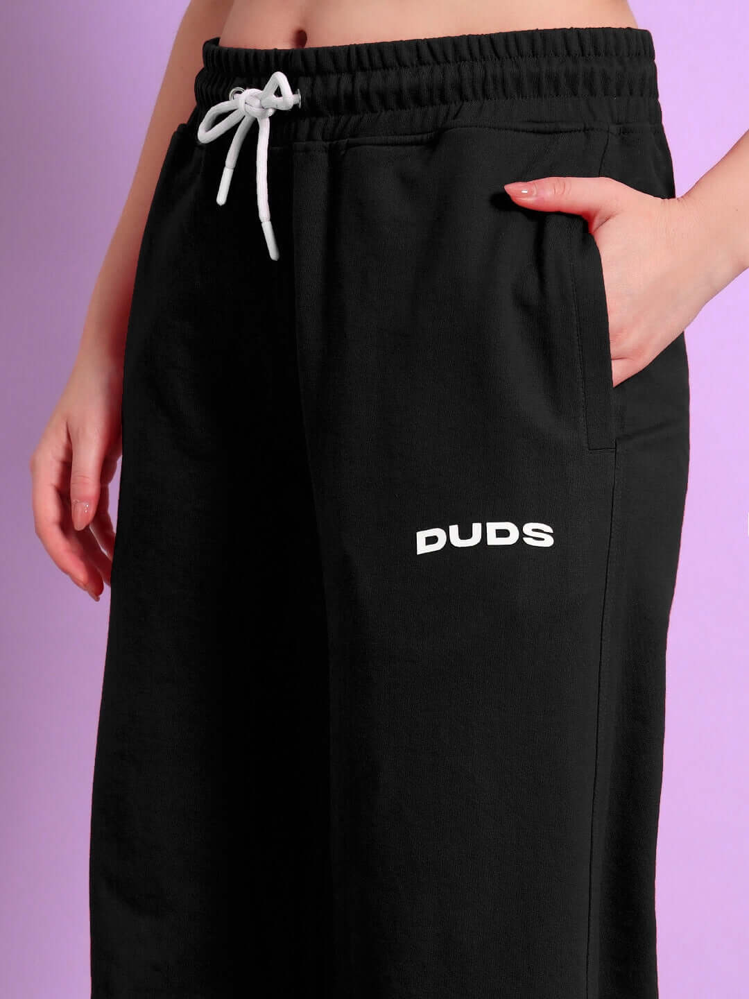 WOMENS AUSTRIAN RELAXED-FIT JOGGERS BLACK with side view showing pockets and logo, perfect for casual wear and comfort.