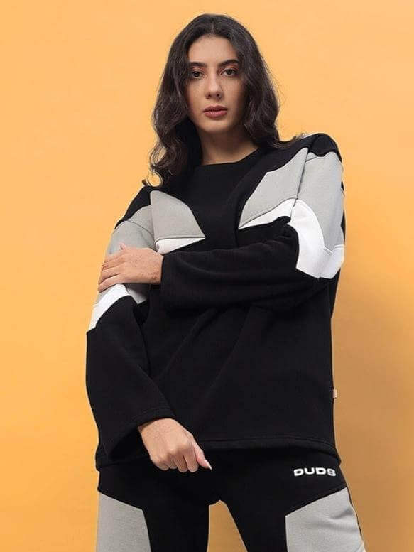 Model wearing women's black aviator fleece colorblock co-ord, featuring stylish design and comfort.
