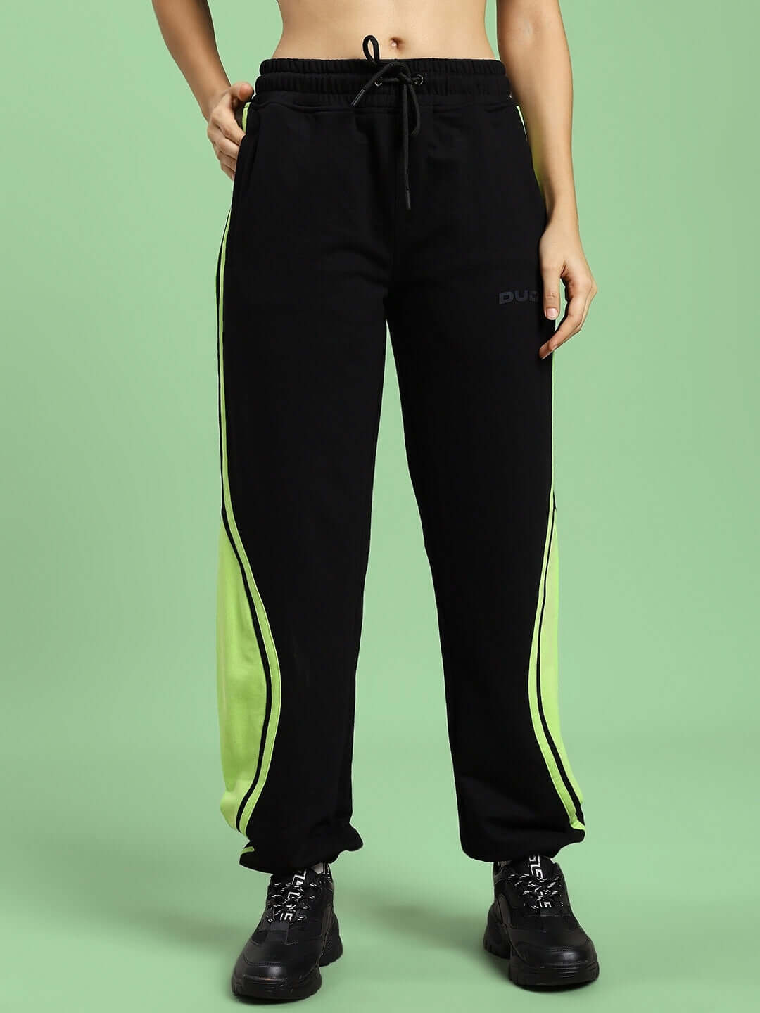 Women's Aziza Co-Ord Set in black and neon-green with relaxed fit joggers, elasticated waistband, 97% cotton, and 3% elastane.
