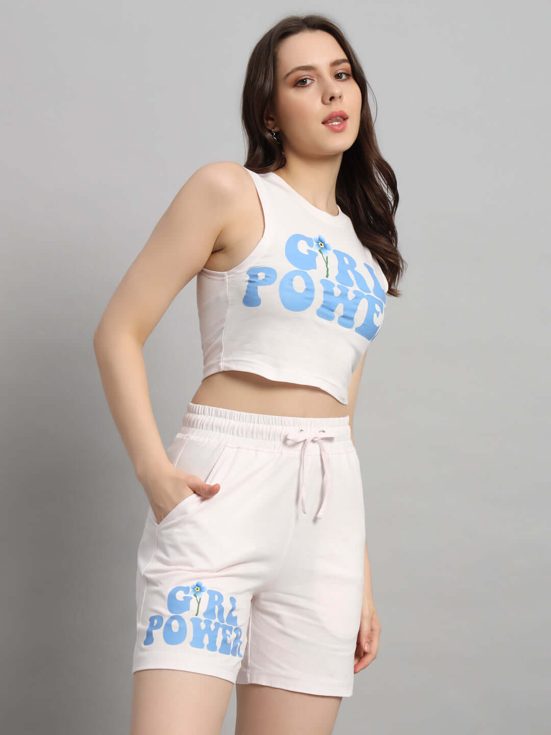 Model wearing Women's Girl Power co-ord set in baby pink with blue print, crafted from premium cotton and elastane for comfort.