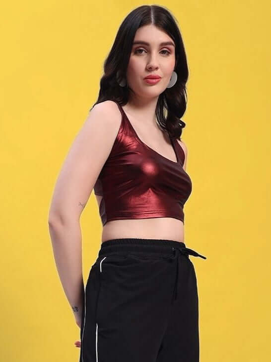 Model wearing maroon metallic women's crop top, stylish solid design, perfect for casual wear; Suitable for cold machine wash.