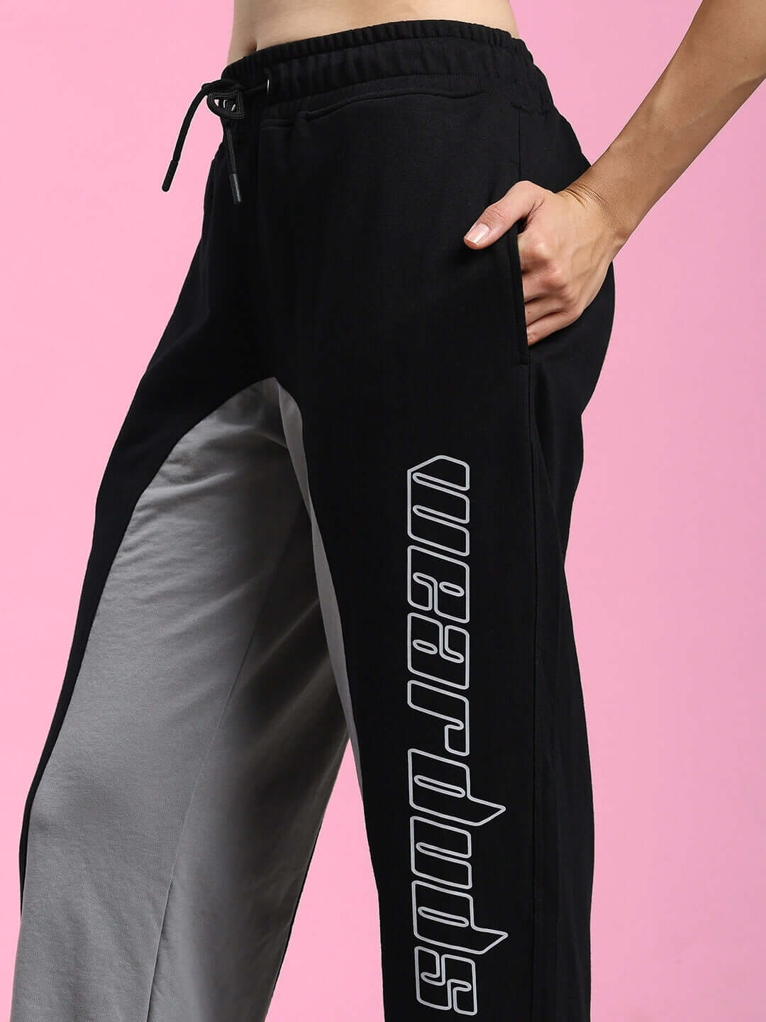 WOMENS BERLIN RELAXED FIT JOGGERS BLACK GREY showcasing stylish two-tone design with comfortable fit on pink background.