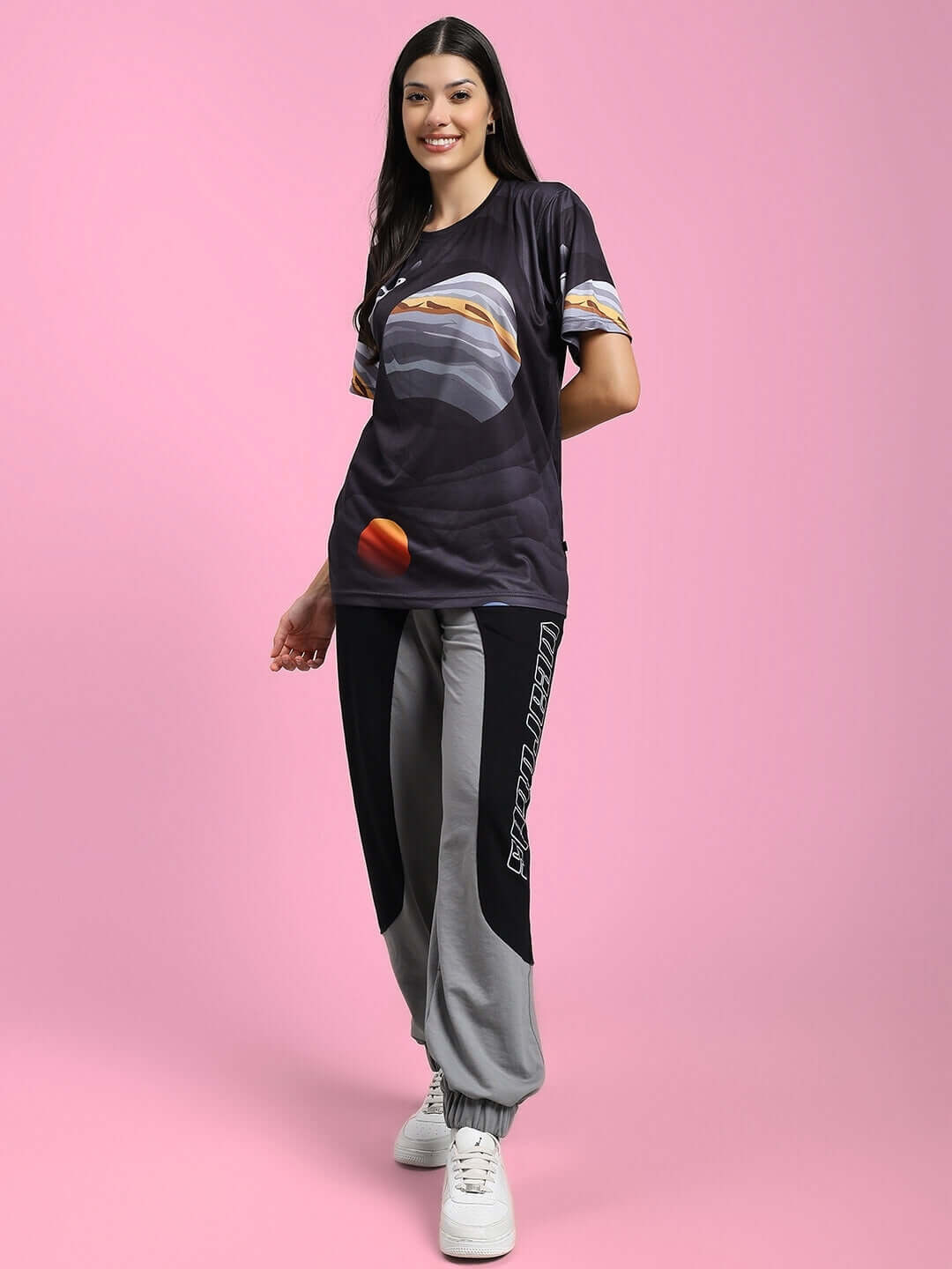 Woman wearing Womens Berlin Relaxed Fit Joggers Black Grey, showcasing style and comfort in athleisure fashion.