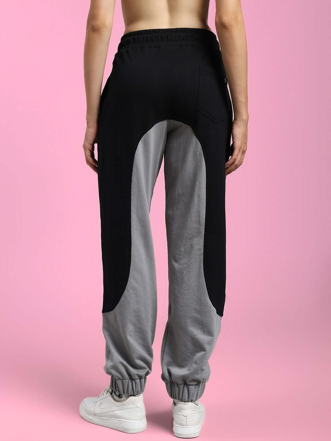 Back view of WOMENS BERLIN RELAXED FIT JOGGERS BLACK GREY showing style and comfort on a model.