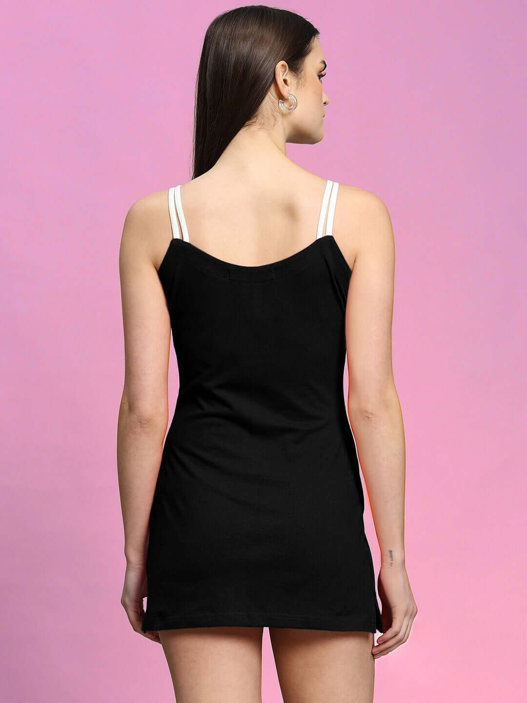 Back view of a woman wearing a black Sweet Bralette Dress, made of polyester and spandex, showcasing elegant design and fit. Made in India.