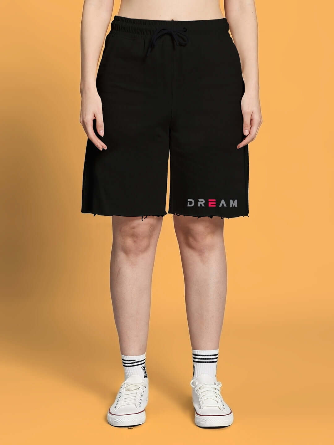 Model wearing WOMEN'S FANCY DREAM CO-ORD SET - BLACK casual shorts with drawstring, perfect for stylish leisure wear.
