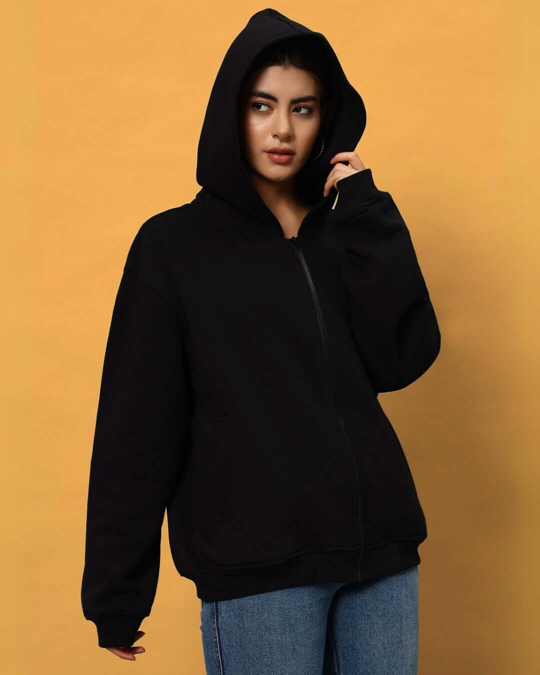 WOMEN NEVER BE AFRAID FLEECE HOODIE BLACK worn by model, showcasing casual style for custom fit options.