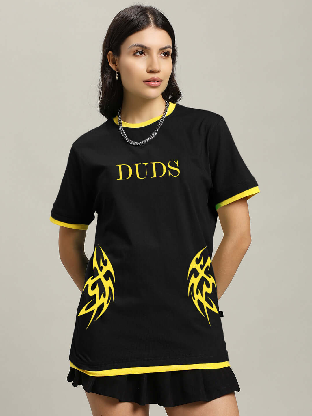 Model wearing Women's Nimo Regular Fit T-Shirt in black with yellow accents, 100% cotton, Duds logo, bio-washed for softness.