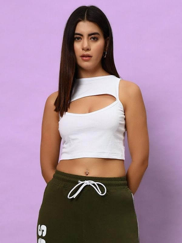 WOMEN BLINK COTTON CROP-TOP WHITE modeled against a purple background, highlighting its chic design and comfortable fit.