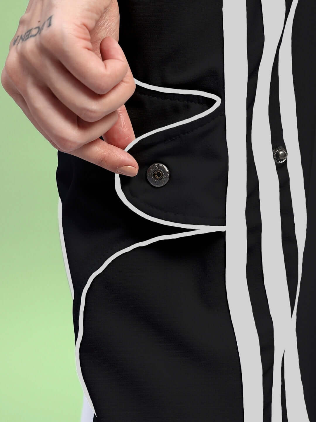 Close-up of WOMENS BOLSON STRIPES RELAXED-FIT JOGGERS BLACK with button detail on black fabric.