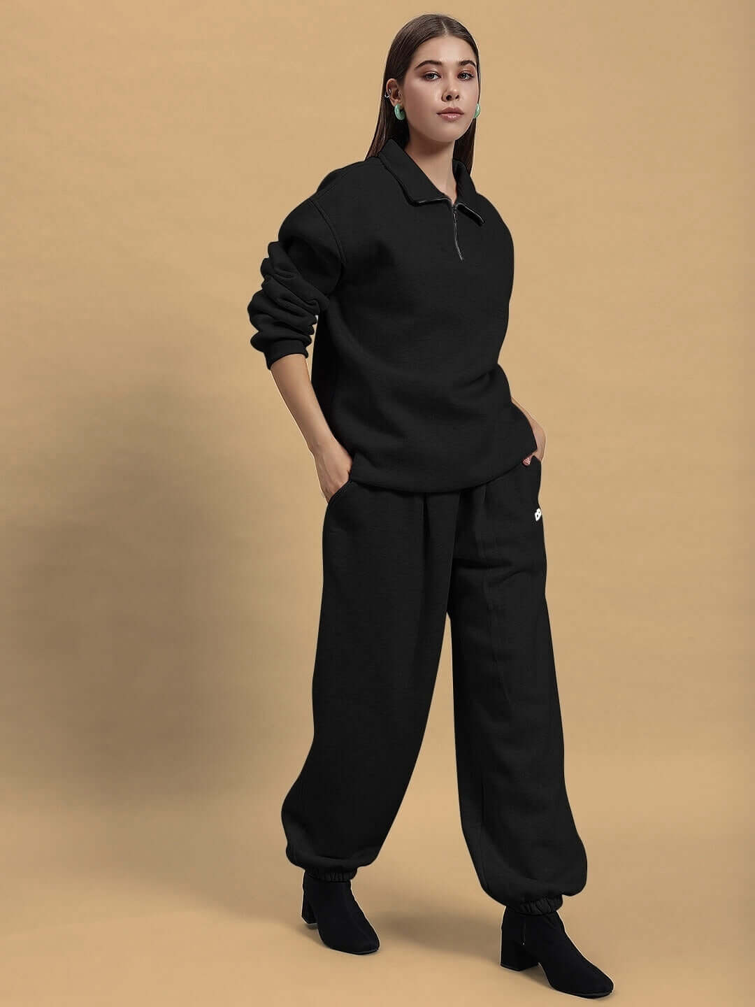 Model wearing Women's Bona-Fide Fleece Co-Ord in black, showcasing relaxed fit with customizable options, styled for casual elegance.