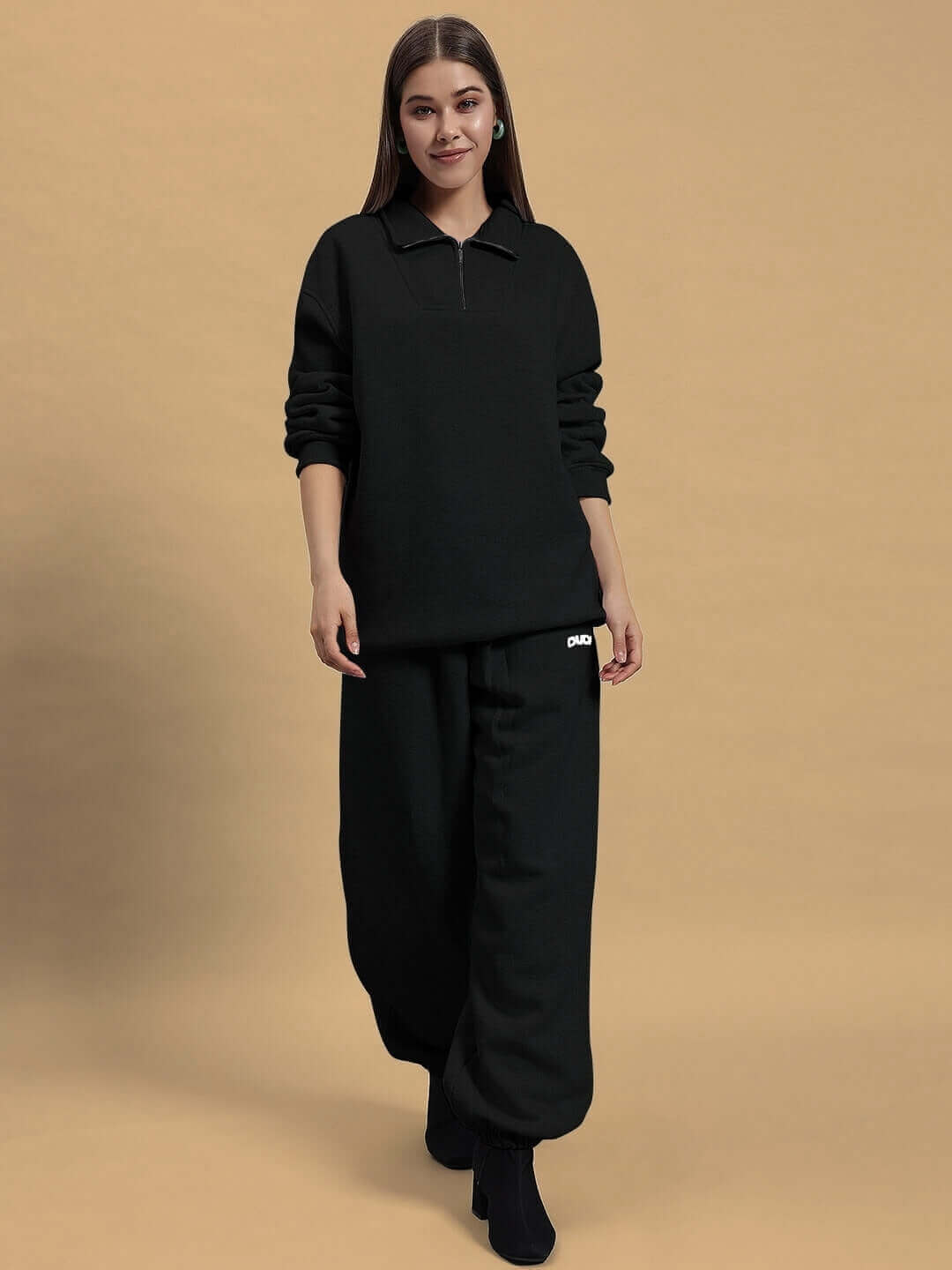 Model wearing Women's Bona-Fide Fleece Co-Ord in black, featuring a cozy, made-to-order design by DUDS Tailors.