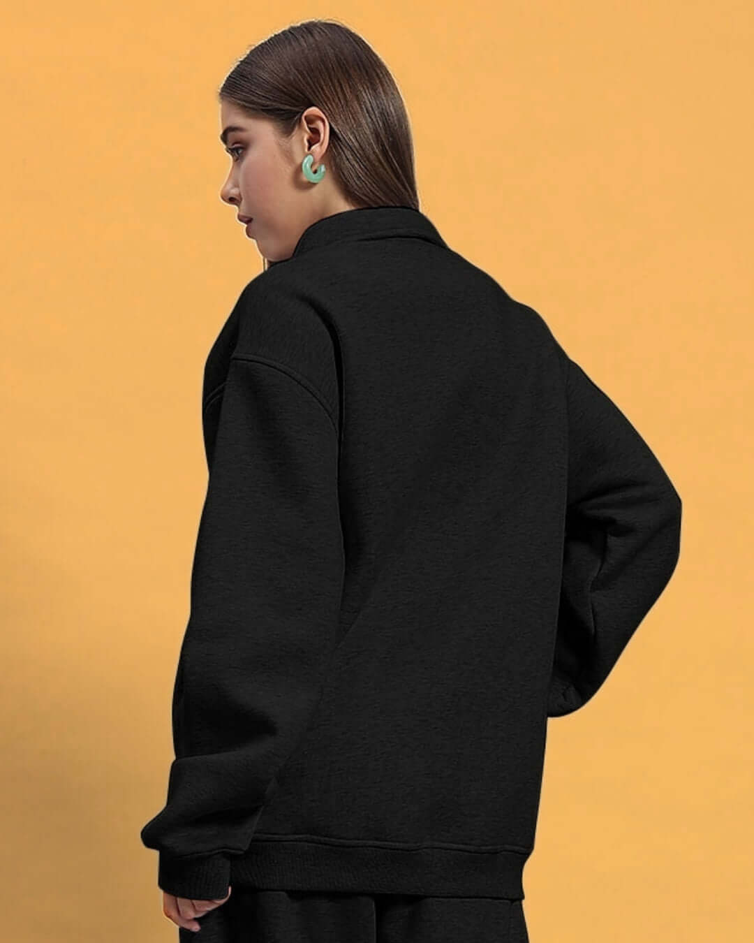 Woman wearing black BONA-FIDE sweatshirt from DUDS, customizable size available, back view with stylish design.