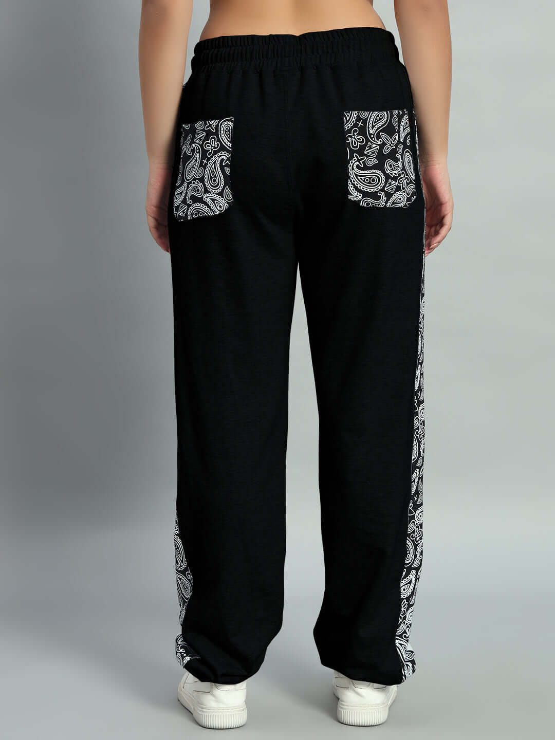 Back view of Women's Boogie Relaxed Fit Joggers in black, featuring paisley print pockets and side panels, tailored by DUDS.