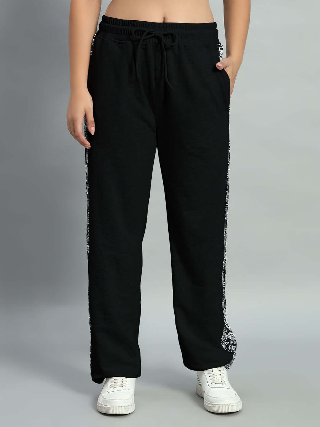 Model wearing black Women's Boogie Relaxed Fit Joggers from DUDS, featuring custom fit option and tailored craftsmanship.