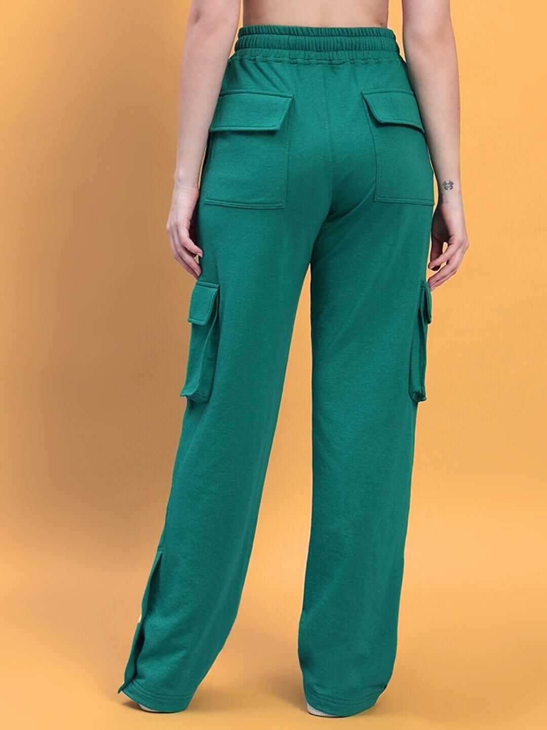 Back view of women's teal green cargo pants, featuring 8 pockets and a relaxed fit. Perfect for utility and style, made by DUDS.