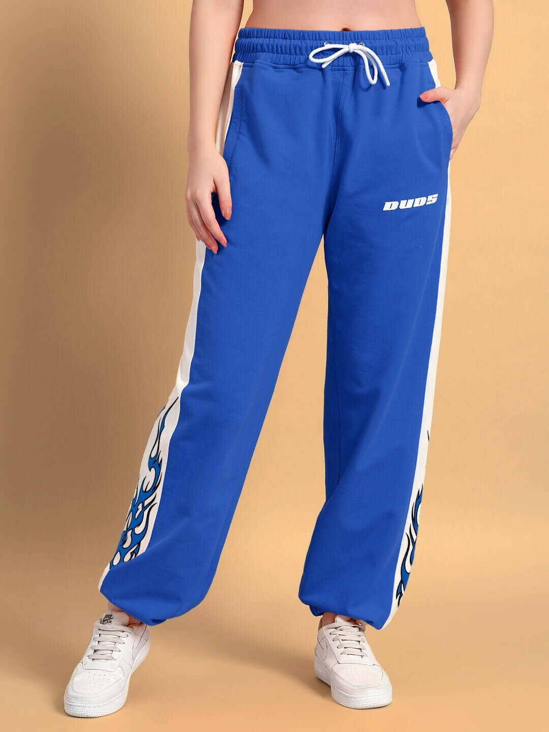 WOMENS BRACER RELAXED FIT JOGGERS BLUE-WHITE with white drawstring and flame detailing on sides, perfect for casual outings or lounging.