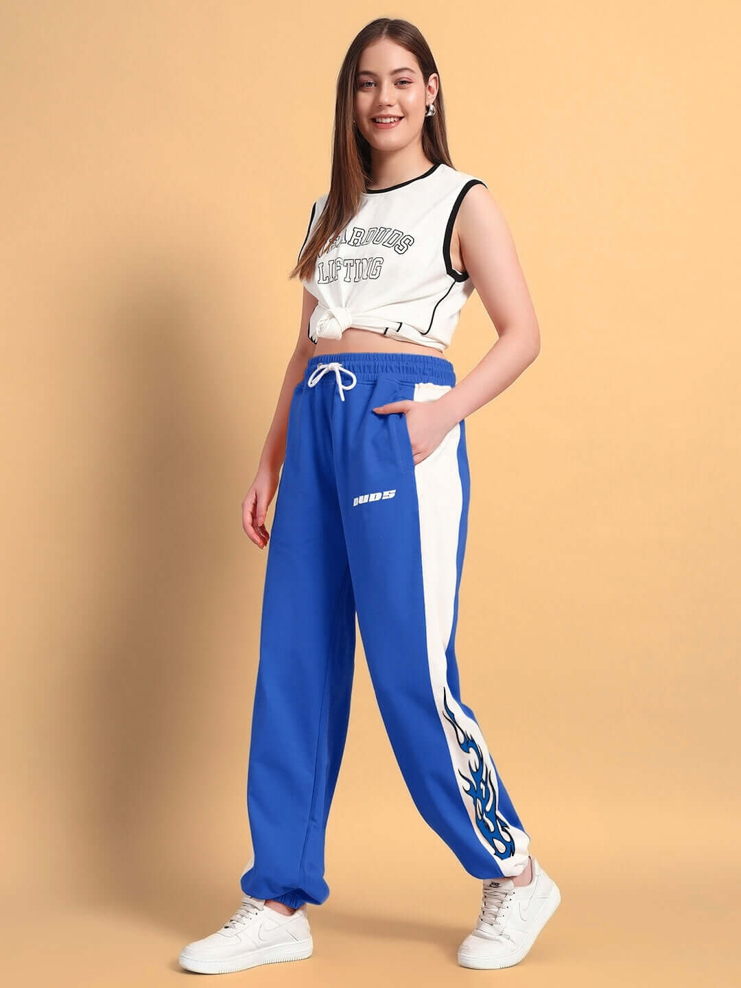 Woman wearing WOMENS BRACER RELAXED FIT JOGGERS BLUE-WHITE, casual style, blue and white color, relaxed fit joggers, comfortable outfit